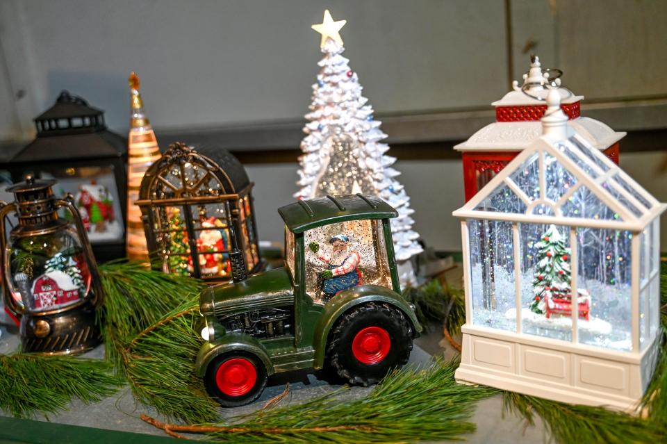 Snow globe gifts for sale at Tannenbaum Farms on Monday, Nov. 20, 2023, in Mason.