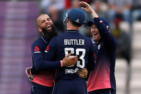 FILE PHOTO - Cricket - England vs West Indies - Fifth One Day International - The Rose Bowl, Southampton, Britain - September 29, 2017 England's Moeen Ali celebrates taking the wicket of West Indies' Marlon Samuels with Jos Buttler and Eoin Morgan Action Images via Reuters/Paul Childs