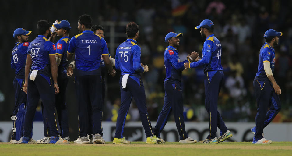 Sri Lanka's team members celebrate their team's victory over South Africa by 178 runs in the fifth one-day international cricket match in Colombo, Sri Lanka, Sunday, Aug. 12, 2018. (AP Photo/Eranga Jayawardena)