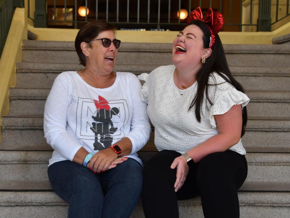 megan and her mom posing for a photo at magic kingdom in disney world