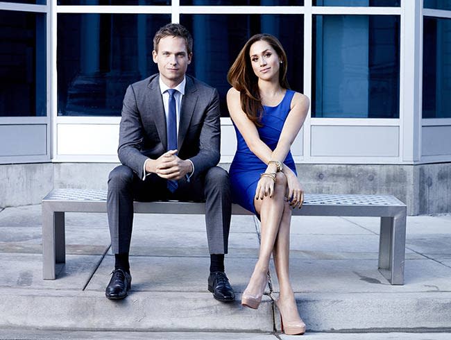 Meghan Markle sitting with Patrick J. Adams on a bench