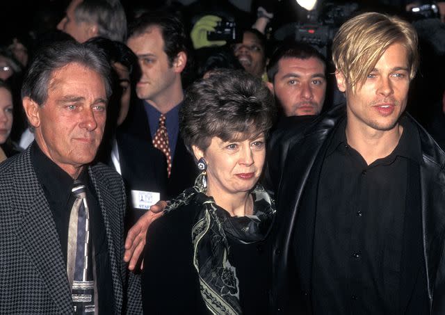 <p>Ron Galella/Ron Galella Collection/Getty</p> Brad Pitt and parents William Pitt and Jane Pitt at "The Devil's Own" New York City premiere on March 13, 1997.