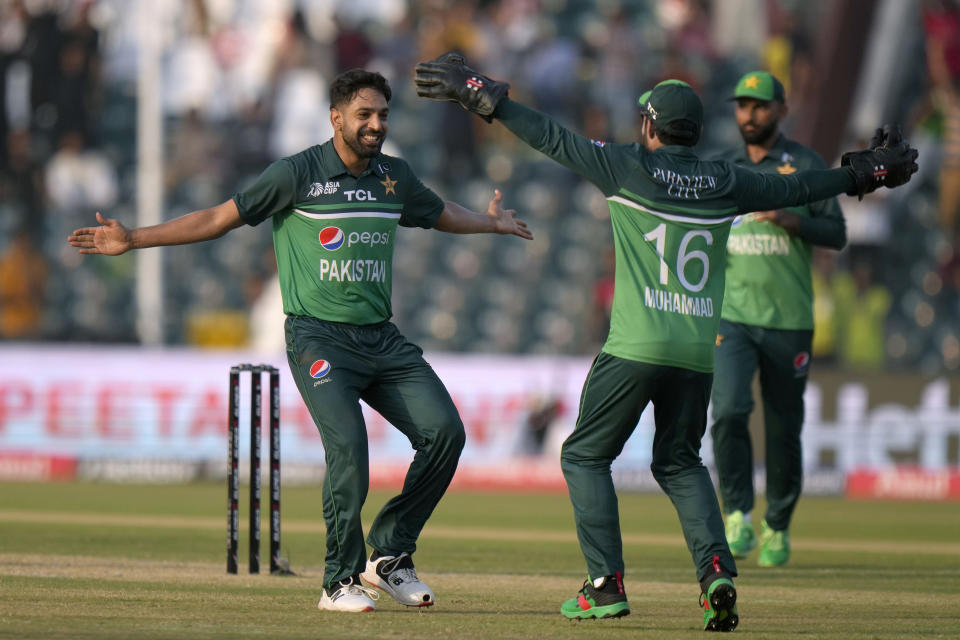 Pakistan's Haris Rauf, left, celebrates with teammates after taking the wicket of Bangladesh's Taskin Ahmed during the Asia Cup cricket match between Pakistan and Bangladesh in Lahore, Pakistan, Wednesday, Sept. 6, 2023. (AP Photo/K.M. Chaudary)