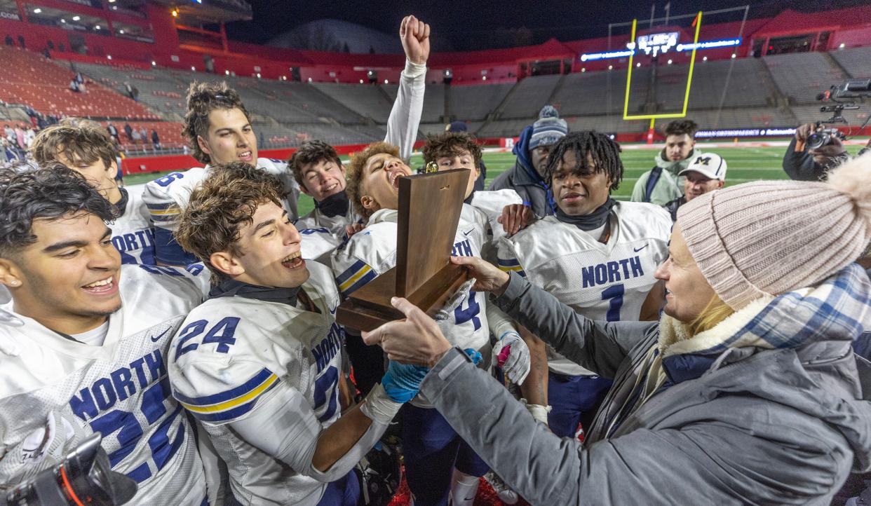 North captains are presented with their trophy. Toms River North football defeats Passaic Tech 23-13 in NJSIAA Group 5 Football Championship at Rutgers University on November 27, 2023.