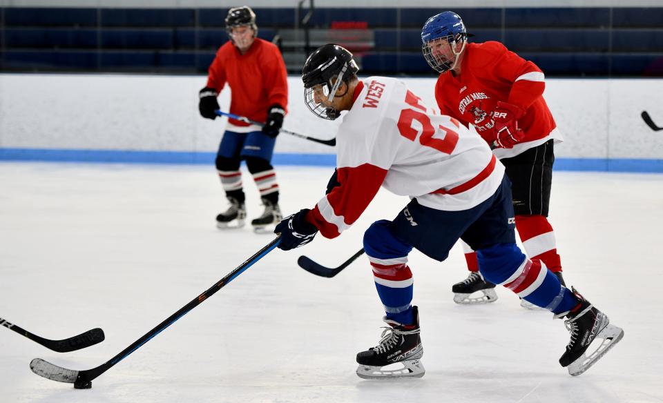 Tim West, 68, of Oxford cuts across the ice during Central Mass Rusty Blades practice.