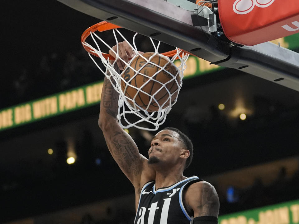 Atlanta Hawks guard Dejounte Murray (5) scores during the first half of an NBA basketball game against the Cleveland Cavaliers Wednesday, March 6, 2024, in Atlanta. (AP Photo/John Bazemore)