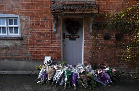 Floral tributes are seen outside the house of singer George Michael, where he died on Christmas Day, in Goring, southern England, Britain December 26, 2016. REUTERS/Eddie Keogh
