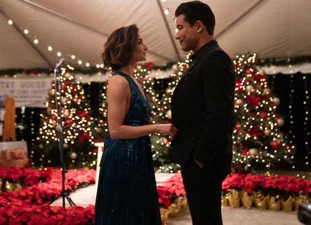 <p>Great American Media</p> Courtney (left) and Mario Lopez in <em>Once Upon a Christmas Wish</em>