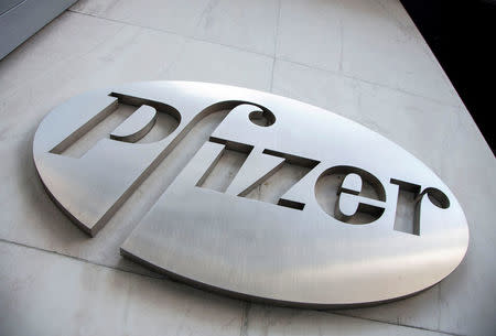 FILE PHOTO: The Pfizer logo is seen at their world headquarters in New York April 28, 2014. REUTERS/Andrew Kelly/File Photo