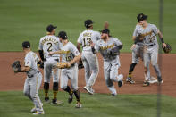 Member of the Pittsburgh Pirates celebrate their win over the St. Louis Cardinals in a baseball game Friday, June 25, 2021, in St. Louis. (AP Photo/Joe Puetz)