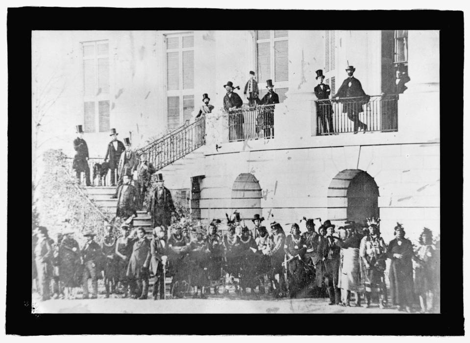 This photograph, taken by Mathew Brady during the James Buchanan administration, shows a group of Native Americans and white men by the South Portico. The Native Americans are believed to be representatives from the Ponca, Pawnee, Potawatomi, and Sac and Fox nations.