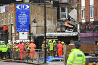 Emergency services at the scene of a suspected gas explosion on King Street in Ealing, west London. Rescuers are involved in a "complex" search for anyone who may still be inside the collapsed building. (Photo by Dominic Lipinski/PA Images via Getty Images)