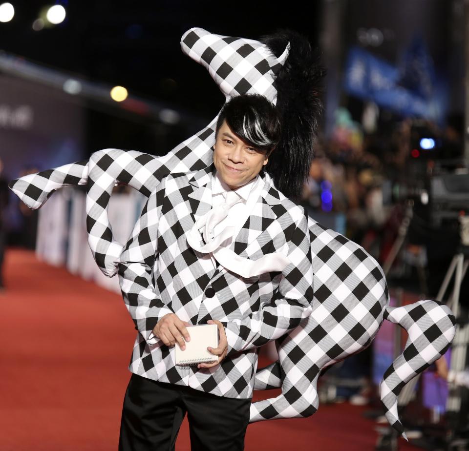 Taiwanese host Tsai poses for photographers on the red carpet at the 50th Golden Horse Film Awards in Taipei