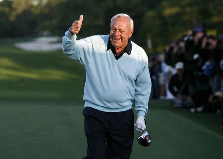 Arnold Palmer gestures after hitting a drive to begin the 2007 Masters golf tournament on the first tee at the Augusta National Golf Club in Augusta, Georgia, U.S. on April 5, 2007. REUTERS/Mike Blake/Files