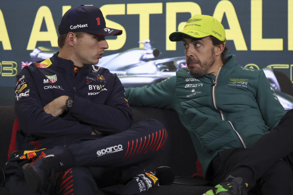 Max Verstappen of Netherlands and Aston Martin driver Fernando Alonso of Spain, right, attend a post-race press conference after the Australian Formula One Grand Prix at Albert Park in Melbourne, Sunday, April 2, 2023. Verstappen won the race while Alonso took 3rd. (AP Photo/Asanka Brendon Ratnayake)