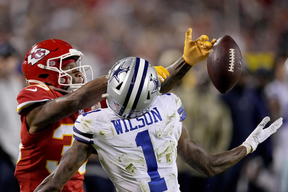 Kansas City Chiefs cornerback Charvarius Ward, left, breaks up a pass intended for Dallas Cowboys wide receiver Cedrick Wilson (1) during the second half of an NFL football game Sunday, Nov. 21, 2021, in Kansas City, Mo. (AP Photo/Charlie Riedel)