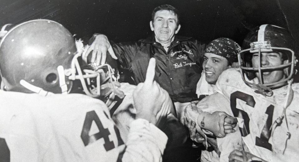 The Beaver Bobcats carry head coach Pat Tarquinio off the field after a playoff win in 1979.