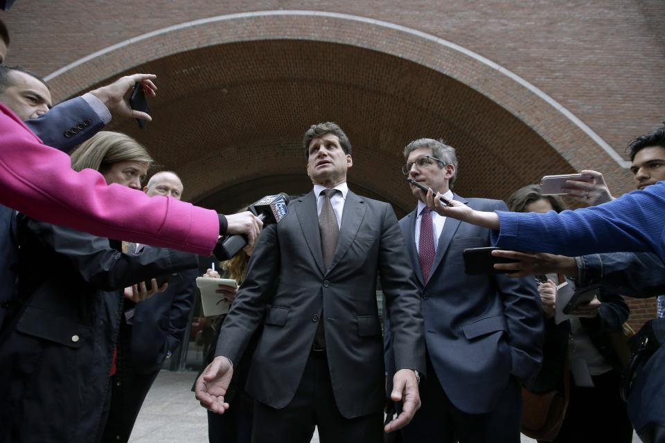 Gordon Caplan speaks to the media outside federal court, Thursday, Oct. 3, 2019, in Boston, after being sentenced in a nationwide college admissions bribery scandal. Caplan was sentenced to one month in prison for paying $75,000 to rig his daughter’s ACT exam. (AP Photo/Steven Senne)