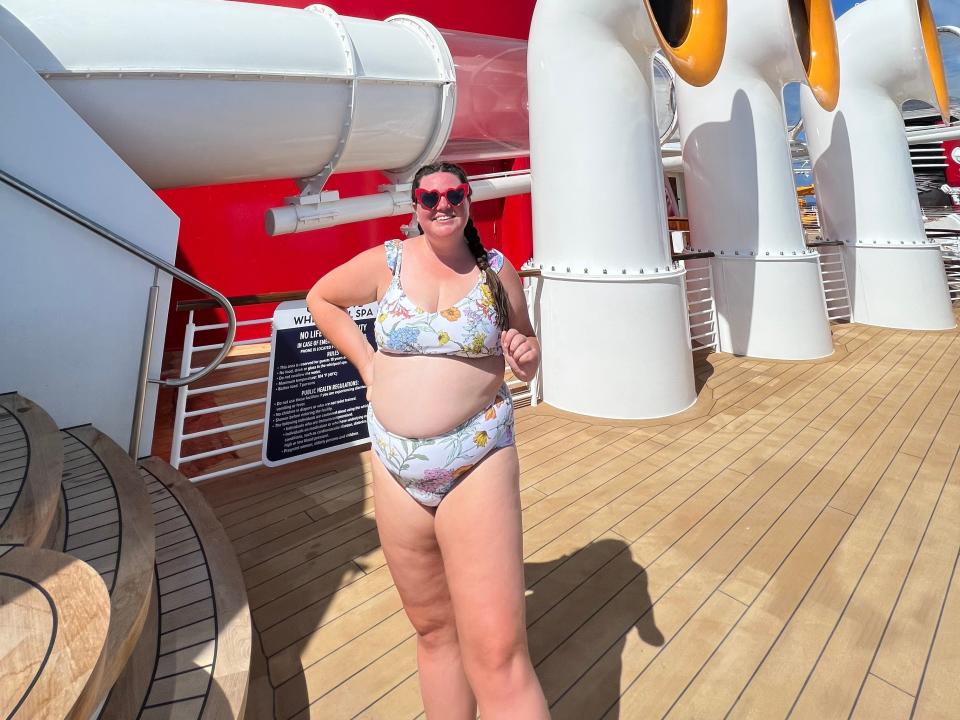 megan wearing her swimsuit on the deck of a disney cruise ship