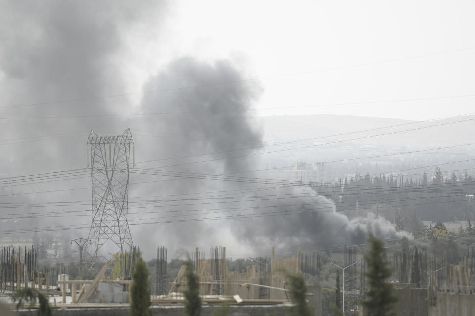 File - Smoke rises in the countryside of Damascus, Syria, on Saturday Oct 30, 2021, following what Syrian state media said was an Israeli airstrike. According to SANA, the country's air defenses responded to missiles fired from Israel toward suburbs of the capital Damascus.(AP Photo/Omar Sanadiki)