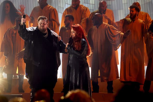 <p>Terry Wyatt/Getty</p> Jelly Roll (left) and Wynonna Judd perform together during the opening number of the 2023 CMA Awards