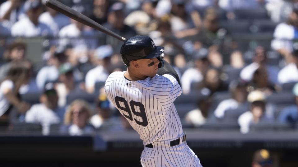 May 28, 2023;  Bronx, New York, USA;  New York Yankees right fielder Aaron Judge (99) hits an RBI single against the San Diego Padres in the third inning at Yankee Stadium.