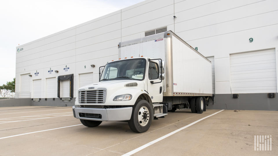 A white box truck parked at a Prologis facility