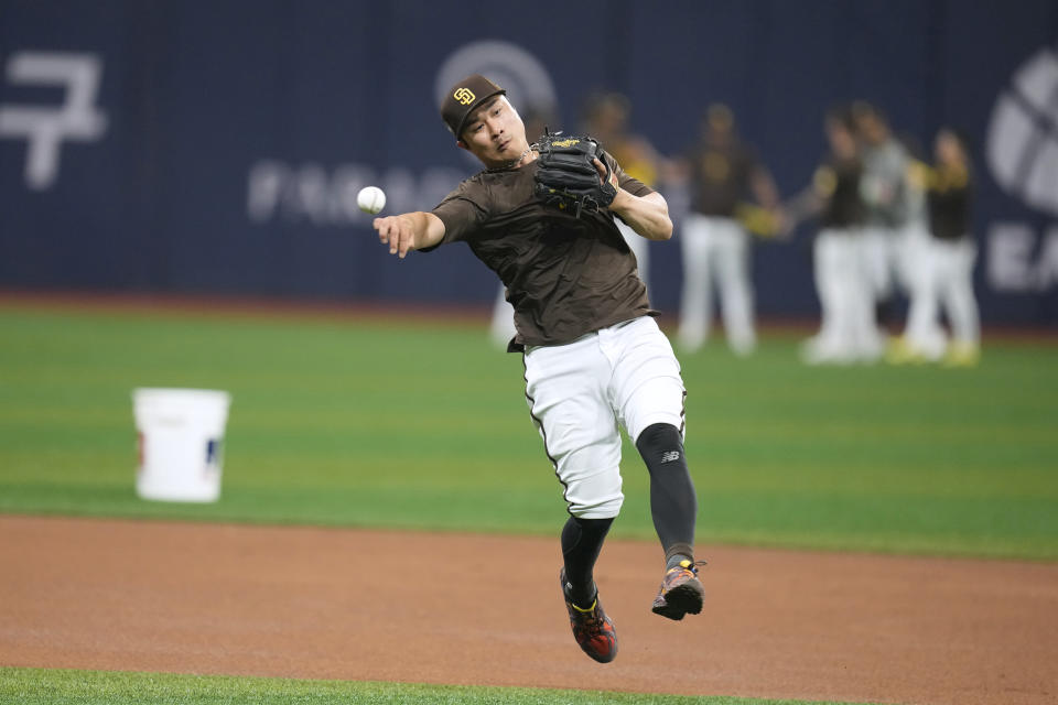 San Diego Padres Ha-Seong Kim fields a ground ball during a baseball workout at the Gocheok Sky Dome in Seoul, South Korea, Tuesday, March 19, 2024. Major League Baseball's season-opening games between the Los Angeles Dodgers and San Diego Padres in Seoul will be the first MLB games held in the baseball-loving nation.(AP Photo/Lee Jin-man)