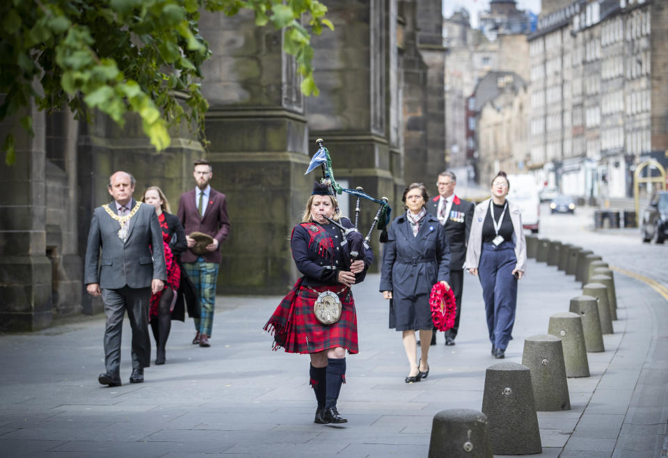 Piper Louise Marshall plays the pipers' march "Heroes of St Valery" and leads the procession down Edinburgh's Royal Mile during the St Valery commemoration to remember the thousands of Scots who were killed or captured during "the forgotten Dunkirk" 80 years ago.