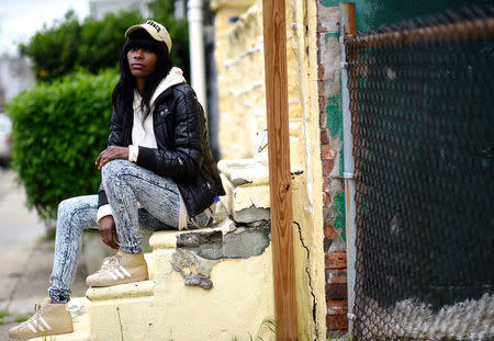 Lakesha Johnson, a homeless health care aide, poses for a photo in Philadelphia, Pennsylvania, U.S. April 26, 2017. REUTERS/Mark Makela