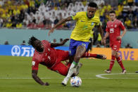 Switzerland's Breel Embolo, left, and Brazil's Eder Militao vie for the ball during the World Cup group G soccer match between Brazil and Switzerland, at the Stadium 974 in Doha, Qatar, Monday, Nov. 28, 2022. (AP Photo/Natacha Pisarenko)