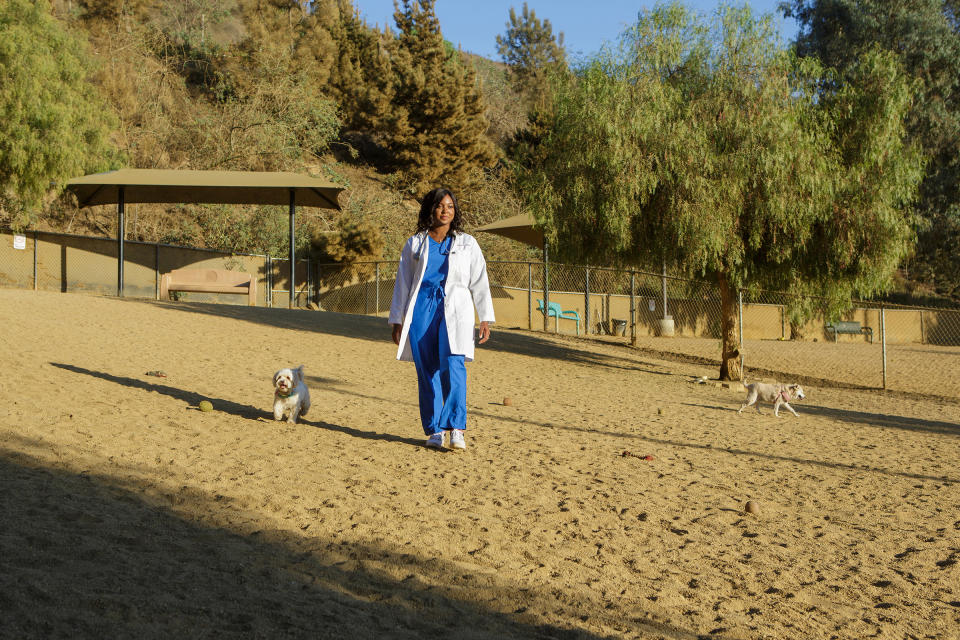 Flossie runs alongside Price during a visit to the Culver City dog park on Oct. 12.<span class="copyright">Amanda Lopez for TIME</span>