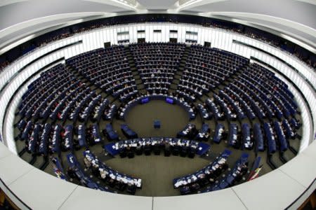 FILE PHOTO: Members of the European Parliament take part in a voting session at the European Parliament in Strasbourg, France, February 7, 2018. Picture taken with a fisheye lens. REUTERS/Vincent Kessler