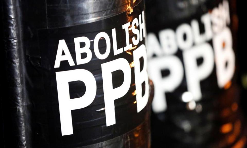 A sign reading ‘Abolish PPB’ is seen on shields held by demonstrators during a protest against police violence and racial injustice in Portland, Oregon, at the weekend.