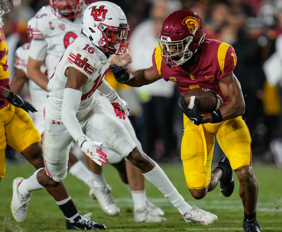 Oct 9, 2021; Los Angeles, California; Utah Utes safety Zemaiah Vaughn (16) and USC Trojans wide receiver Gary Bryant Jr. (1) during the fourth quarter at United Airlines Field at Los Angeles Memorial Coliseum. Robert Hanashiro-USA TODAY Sports