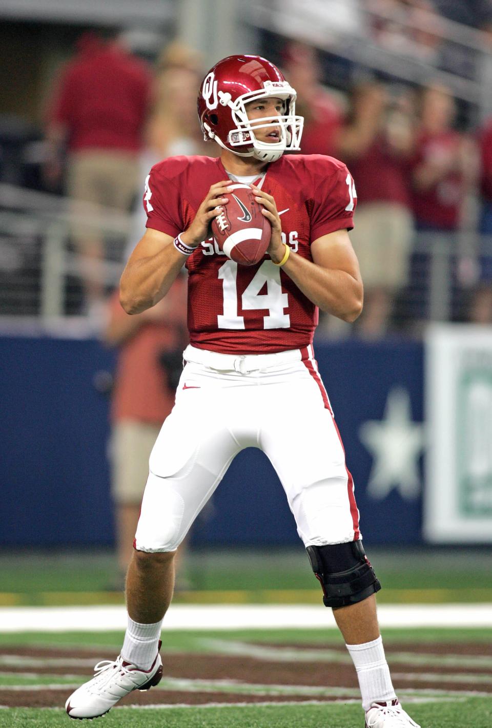 Oklahoma Sooners quarterback Sam Bradford (14) warms up before the game against the BYU Cougars at Cowboys Stadium in 2009.