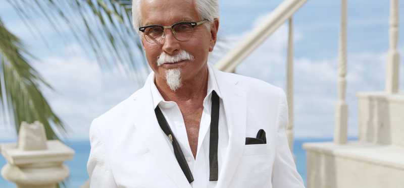 Actor George Hamilton is dressed as Col. Sanders.