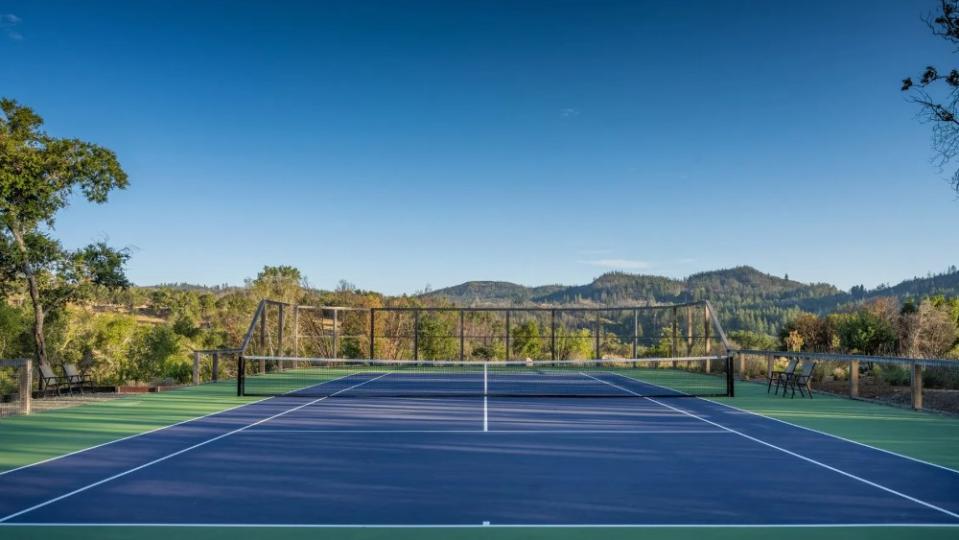 Play a match as the sun sets over the mountains. - Credit: Sothebys International Realty