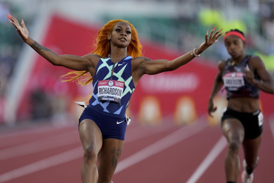 Sha'Carri Richardson celebrates after winning the fourth heat during the women's 100-meter run at the U.S. Olympic Track and Field Trials Friday, June 18, 2021, in Eugene, Ore. (AP Photo/Ashley Landis)