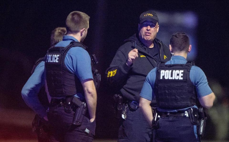 KCPD officers talk near the scene of a standoff in the 2300 block of Blue Ridge Boulevard on Tuesday, Feb. 28, 2023, in Kansas City.