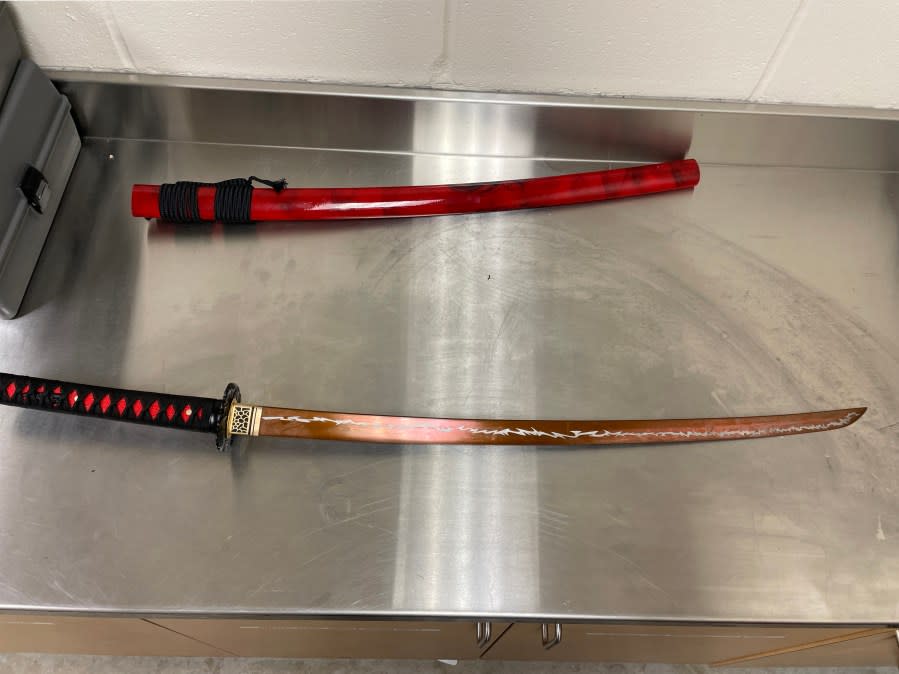 Man accused of 'screaming, threatening' with samurai sword in Walmart parking lot