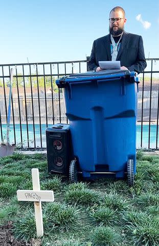 <p>Courtesy of Courtney Bishop</p> Jake Bishop speaks at pacifier funeral.