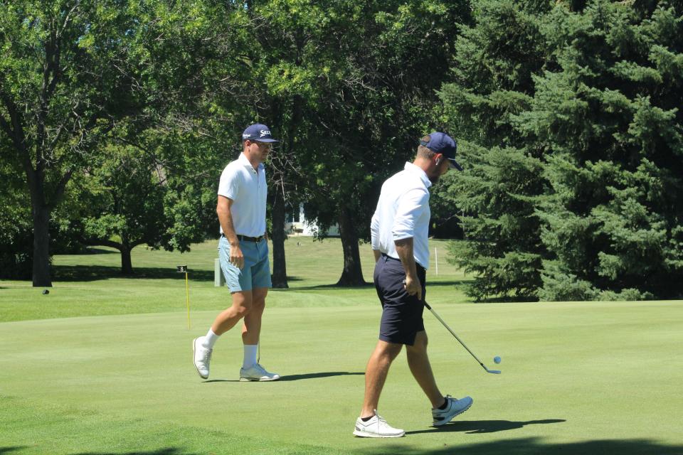 Andrew McCain, left, and Zander Winston practice Thursday at Moccasin Creek Country Club in Aberdeen before the Western Printing Pro-Am.