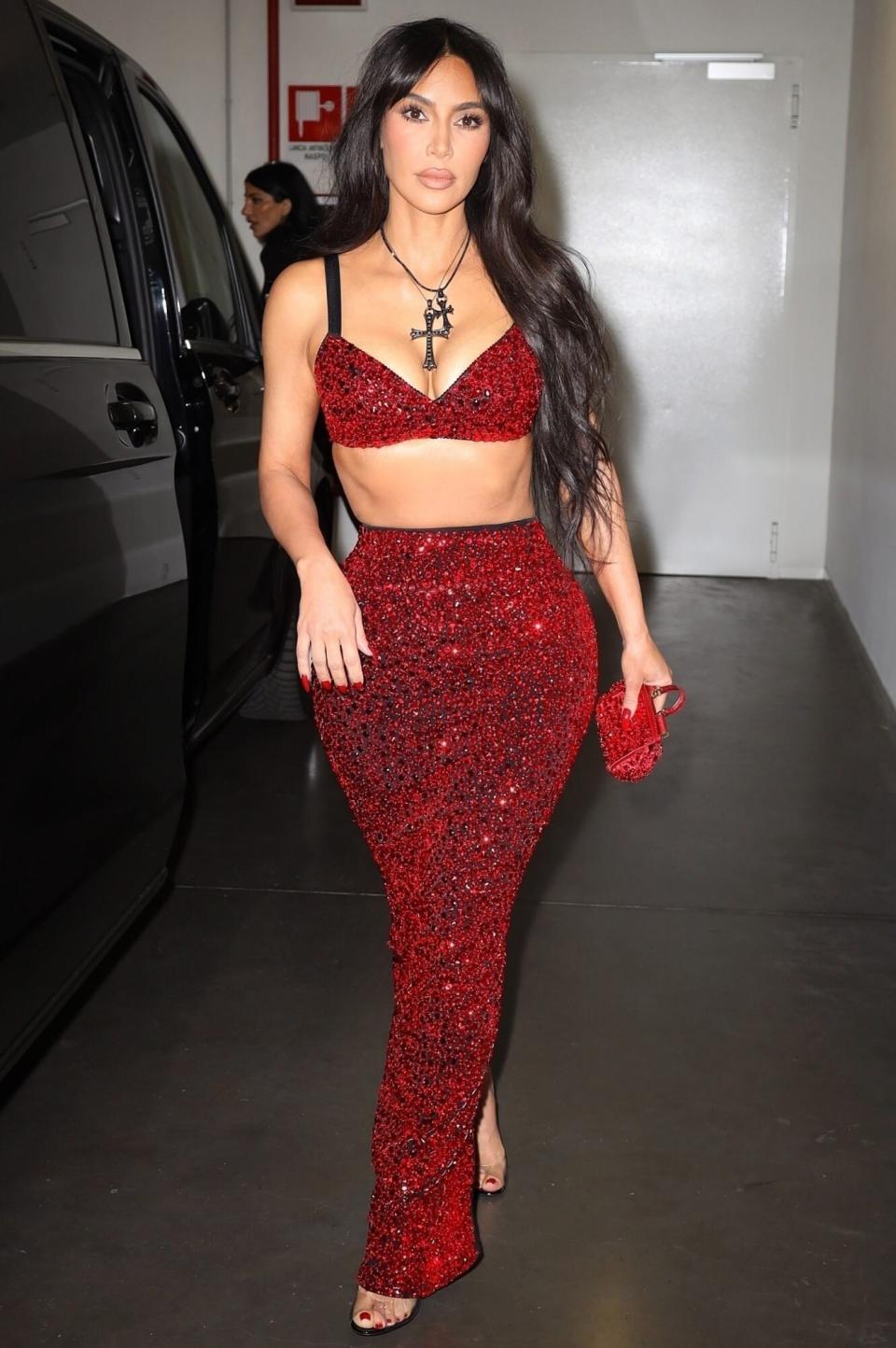 Milan, ITALY - *EXCLUSIVE* - Kim Kardashian turns heads as she graces the Dolce & Gabbana fashion show in Milan, looking fiery in a dazzling jeweled outfit that left everyone in awe. The reality TV queen proves once again that she's a fashion icon to reckon with! Pictured: Kim Kardashian BACKGRID USA 25 FEBRUARY 2023 BYLINE MUST READ: WWW.LUCASGRO.EU / BACKGRID USA: +1 310 798 9111 / usasales@backgrid.com UK: +44 208 344 2007 / uksales@backgrid.com *UK Clients - Pictures Containing Children Please Pixelate Face Prior To Publication*