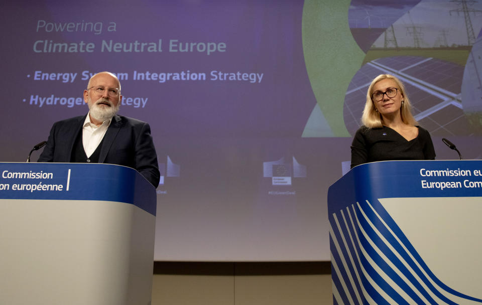 European Commissioner for European Green Deal Frans Timmermans, left, and European Commissioner for Energy Kadri Simson participate in a media conference at EU headquarters in Brussels, Wednesday, July 8, 2020. The EU wants to promote hydrogen produced from renewable electricity as part of its Green Deal plan to make the continent carbon neutral by 2050. (AP Photo/Virginia Mayo, Pool)