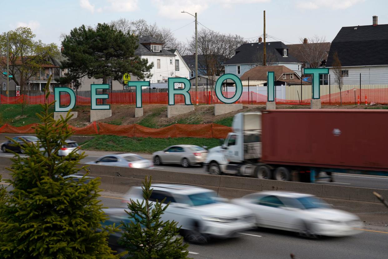 A large Detroit sign is seen in between traffic on the eastbound side of Interstate 94 in Detroit on Tuesday, April 9, 2024.