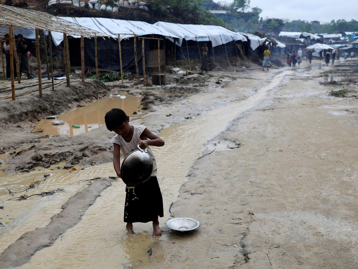 A Rohingya refugee child washes utensil in the in the Balukhali refugee camp in Cox's Bazar, Bangladesh: REUTERS