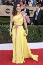 <p>Maybe it was the yellow hue of Salma’s Gucci gown or the huge floral corsage but this one-shouldered design just didn’t seem a good fit for the Mexican beauty. <i>[Photo: Getty]</i> </p>