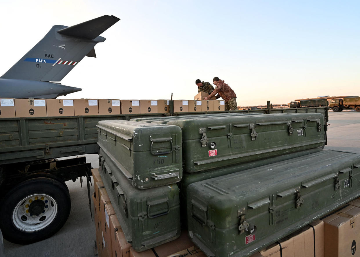 Ukrainian Military Forces load a flat bed truck with boxes at the airport in Kyiv. (Sergei Supinski / AFP via Getty Images file)