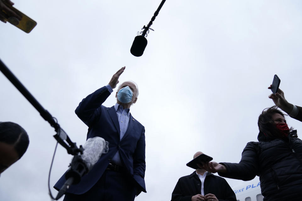 Democratic presidential candidate former Vice President Joe Biden speaks to members of the media before boarding his campaign plane at New Castle Airport, in New Castle, Del., Monday, Oct. 12, 2020, en route to Ohio. (AP Photo/Carolyn Kaster)